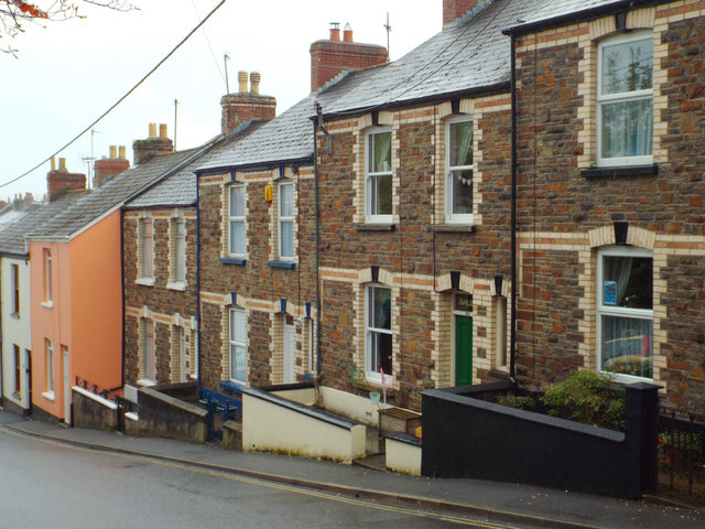 Stepped terraced houses of local stone and two-tone brick, Myrtle Street, Appledore