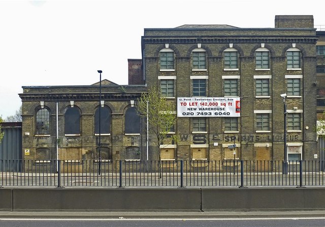 Nineteenth century warehouse, with ghost sign, Bromley-by-Bow