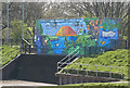 SJ8092 : Murals to combat graffiti on the sluice gate building by Ian Greig