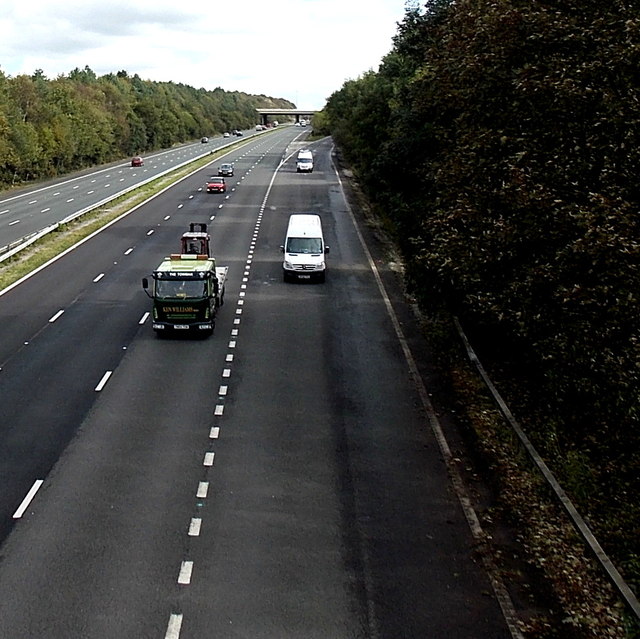 White vans enter the M4 westbound from junction 36, Sarn
