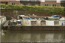 TL3213 : View of a rather dirty narrowboat moored on the River Lea by Robert Lamb