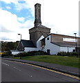 Old chimney stack among new buildings at Glanrhyd Hospital, Bridgend