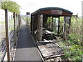 Former railway goods van beside a path in Ynyswen