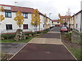 Year stone near recently built houses in Highbridge