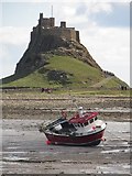 NU1241 : Fishing boat in front of Lindisfarne Castle by Graham Robson