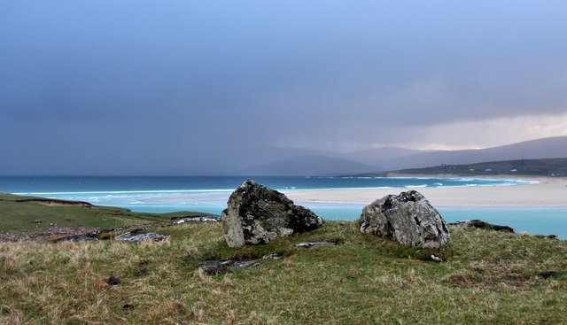 A shower sweeps the tidal crescent of Tràigh Scarasta