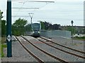 SK5635 : Training tram on Fairham Brook Bridge by Alan Murray-Rust