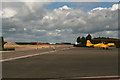 Parked aircraft and construction site at Turweston Aerodrome