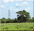 Helicopter hovering over electricity line