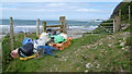 SH2034 : Plastic awaiting collection for recycling at Traeth Penllech by Jeremy Bolwell