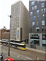 Tram passing Metro One