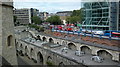 View of traffic coming off Tower Bridge into Tower Hill from the Tower of London