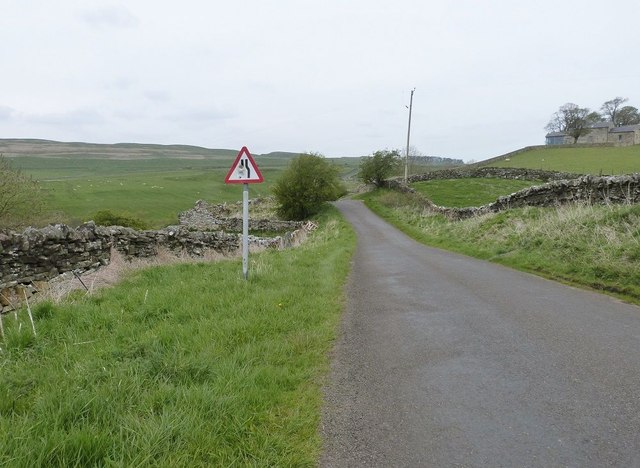 Minor road off the B6318 one and a half km  West of Housesteads