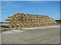 TM2073 : A large stack of straw bales by Evelyn Simak