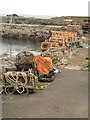 NT9267 : Fishing tackle on the harbour side, St Abbs by Graham Robson