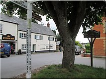 ST0608 : Kentisbeare  Square  signpost  and  village  sign by Martin Dawes
