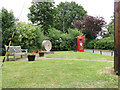 Burgh village sign in the form of a mill stone