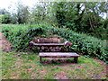 Log bench and wooden table in Woodstock Watermeadows