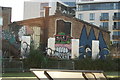 View of wall art on the back of a warehouse building on Fish Island from the River Lea Navigation #2