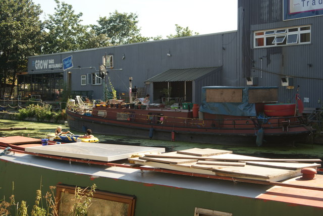 View of a boat moored up at Grow Bar and Restaurant from the River Lea Navigation