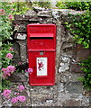 Queen Elizabeth II postbox in a Ferryside wall