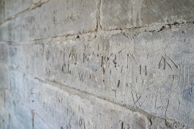 Church of St Andrew, Pickworth:  Graffiti in the porch