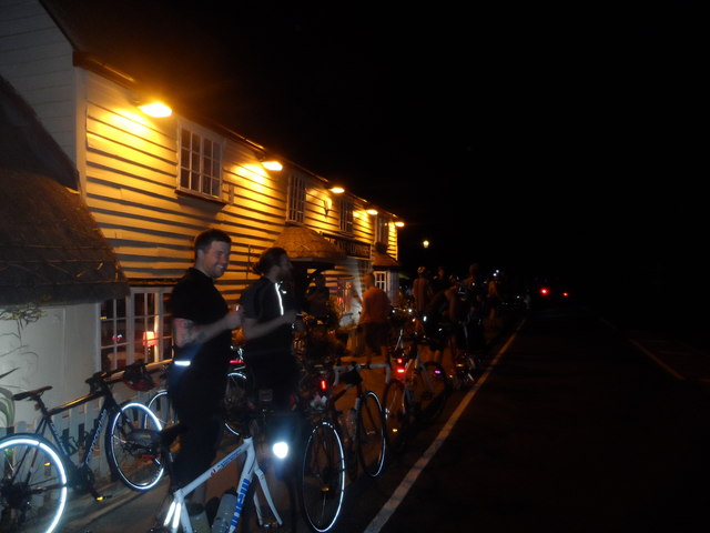 Bike riders outside of the Axe and Compasses