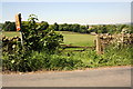 Gateway on west side of road opposite Butler Hill