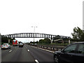 TQ0077 : M4 Motorway & footbridge by Geographer