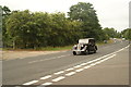 View of a second Austin 14 passing along London Road as part of the London-Southend Classic Car Run