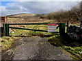 Metal barrier at the edge of a track near Albert Street, Caerau