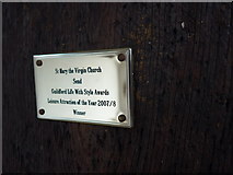 TQ0154 : St Mary the Virgin, Send: award plaque on the south door by Basher Eyre