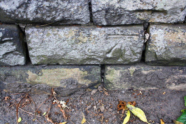 Benchmark on wall at junction of Bingley Road and Highfield Terrace