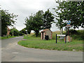 Bus shelter and village sign at Little Snoring