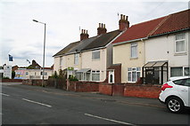 TA3427 : Terrace of houses with garden wall: A1033 through Withernsea by Chris