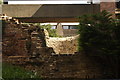 View of a notch in the ruins of the London Wall from the area near Barbican Estate