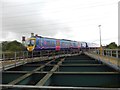 SE8211 : Trans Pennine Express train on the Vazon sliding bridge by Graham Hogg