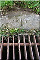 SD6095 : Benchmark on drain surround on road over M6 near Lambrigg by Roger Templeman