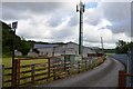 Phone mast and farm buildings at Lower Brockholes