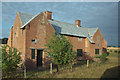 TL8595 : Derelict council houses by Charles Greenhough