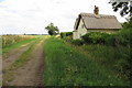 Thatched cottage by the bridleway