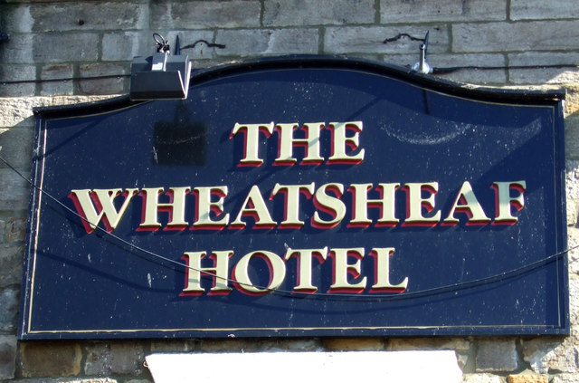 Sign on the Wheatsheaf Hotel, Corbridge