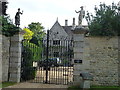 The elegant gates of Polebrook Hall