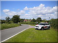 Car on grass verge, Pendock Lane