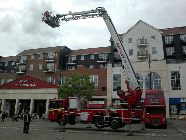 View of a fire engine with its bucket fully open in Romford Market