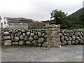 Traditional farm buildings and dry stone wall alongside Tullyframe Road