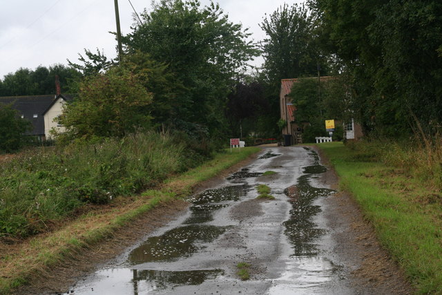 Wet road to Low Barff Farm near Howsham