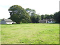 View across field to dwelling and barn