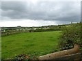 Field by B3362 with Milton Abbot village beyond