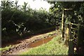 Puddle, track and signpost, Sprydon Walk